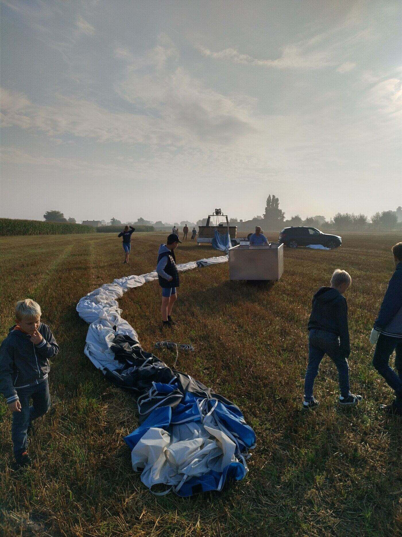 The group helping to pack up the balloon